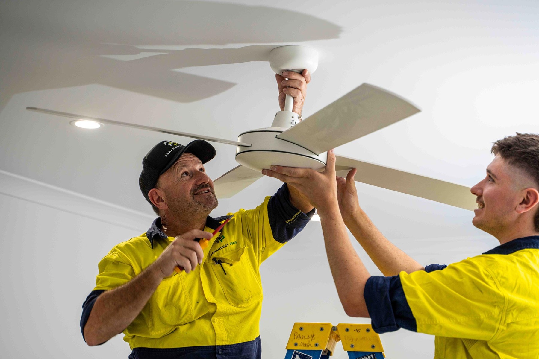 Electrician about to install fan