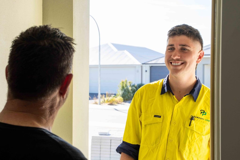 Electrician greeting at door