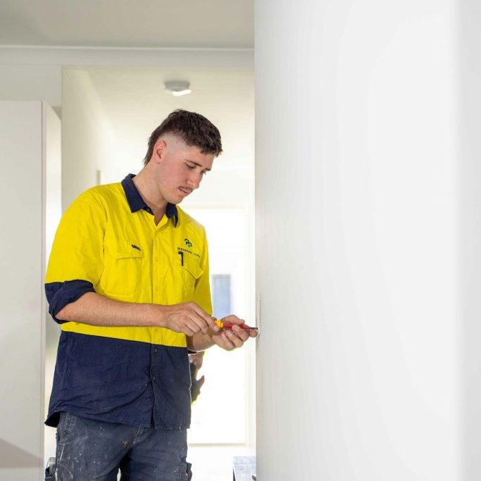 Electrician working on wall plate Electrician working on wall plate